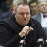 Kim Dotcom speaks during a hearing at Parliament in Wellington, New Zealand.