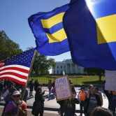Transgender rights activists gather in front of the White House