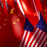 American flags are displayed alongside Chinese flags.