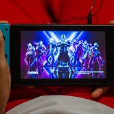 A person loads up the video game Fortnite on a Nintendo Switch.