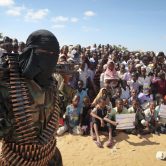 An armed member of the militant group al-Shabab attends a rally near Mogadishu, Somalia.