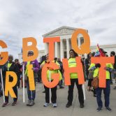 LGBTQ rights activists gather at the U.S. Supreme Court