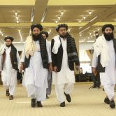 A Taliban delegation arrives for the agreement signing with U.S. officials in Doha, Qatar.