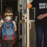 Students arrive at an elementary school in Texas