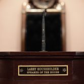 Former Ohio Speaker of the House Larry Householder's name plate is seen on the speaker's dais.
