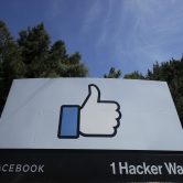 The thumbs-up like logo is shown on a sign at Facebook headquarters