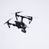 A drone flies in a residential neighborhood in Upper Moreland, Pa.
