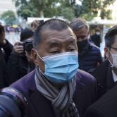Jimmy Lai wears a mask as he arrives for a court hearing in Hong Kong.
