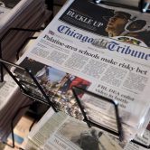 Chicago Tribune and other newspapers are displayed at Chicago's O'Hare International Airport