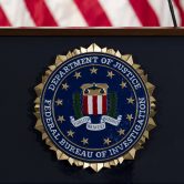 The FBI seal is seen before a news conference at FBI headquarters.
