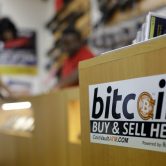 A sticker for an online bitcoin exchange at a gun shop in Austin, Texas.