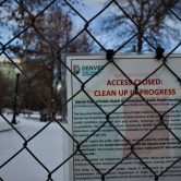 A closure sign posted outside a Denver park.