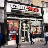 Pedestrians pass a GameStop store in New York.