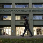 Person passes a government unemployment office.