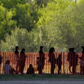 Migrants in custody at a processing facility in Texas