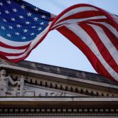 An American flag flies outside the Department of Justice in Washington.
