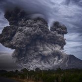 A volcano erupting.