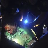 Louisiana state troopers hold Ronald Greene, who is bleeding.