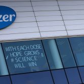 A sign is posted on an upper window at the Pfizer manufacturing center in Puurs, Belgium.