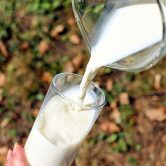 Milk being poured into a glass.