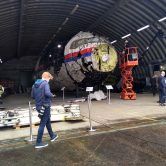 The wrecked MH17 sits in a hangar