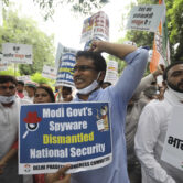 Congress party workers shout slogans during a protest in India.