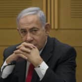 Benjamin Netanyahu speaks to right-wing opposition party members.
