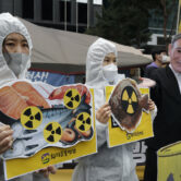 Environmental activists protest the Japanese government's decision on Fukushima water.