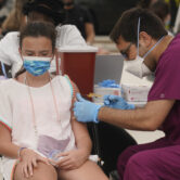 Florida girl gets Covid-19 vaccine shot