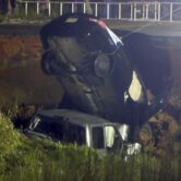 A car is extracted from a collapsed highway