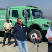 Photo of California Gov. Gavin Newsom and USDA secretary Tom Vilsack discussing forest management and wildfires.