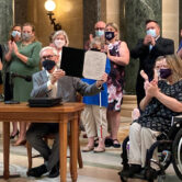 Wisconsin governor signs vetoes at state Capitol