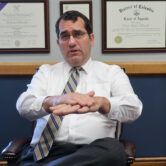 Kansas Attorney General Derek Schmidt speaks during an interview in his office in Topeka.