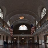This photo shows the Hall of Registry at Ellis Island.