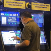 A gambler places a bet at the FanDuel sportsbook in East Rutherford, N.J.