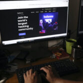 A man visits a hacker community website at a house in Jakarta, Indonesia.
