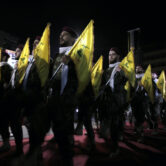 Hezbollah fighters march at a rally to mark Jerusalem Day.