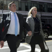 John Wilson arrives at federal court in Boston with his wife Leslie.