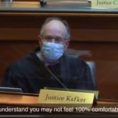 Screenshot showing judge in courtroom with caption