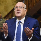 Lebanese Prime Minister Najib Mikati prays as he attends Friday prayers at a mosque.
