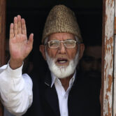 Kashmiri separatist leader Syed Ali Shah Geelani gestures as he speaks to the media.