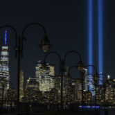 Two vertical columns of light representing the fallen towers of the World Trade Center.