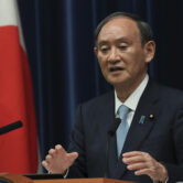 Japanese Prime Minister Yoshihide Suga speaks at a news conference.