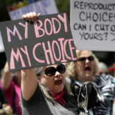 A group gathers to protest abortion restrictions at the State Capitol in Austin, Texas.