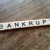 Bankrupt spelled in letter tiles