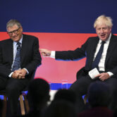 Bill Gates and Boris Johnson on stage at the Global Investment Summit.