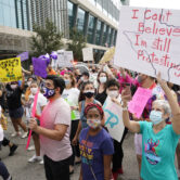 People participate in the Houston Women’s March