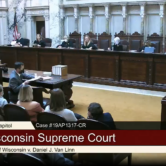Justices and attorneys in Wisconsin Supreme Court hearing room