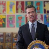 Gavin Newsom speaks during a news conference at a school in San Francisco.
