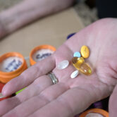 Retiree Donna Weiner shows some of her daily prescription medications.